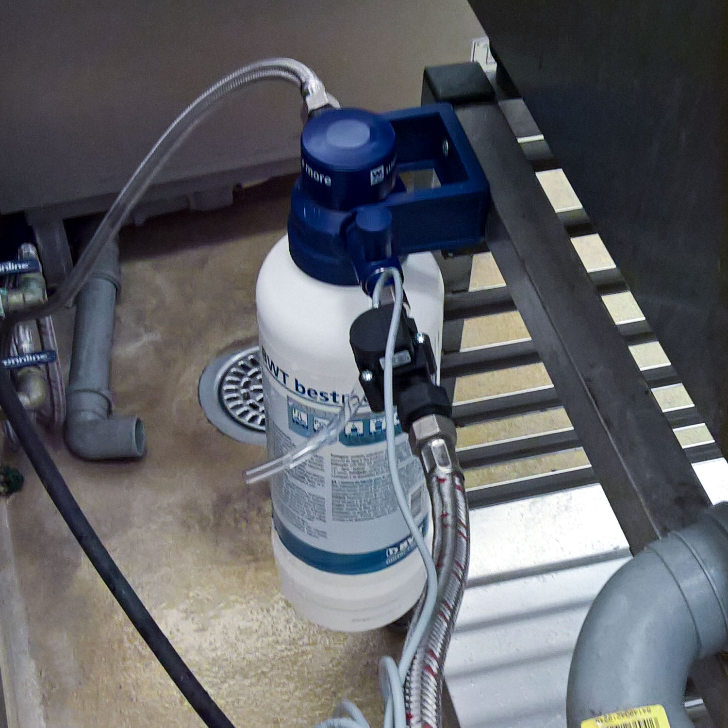 Water softener for hood type dishwashers